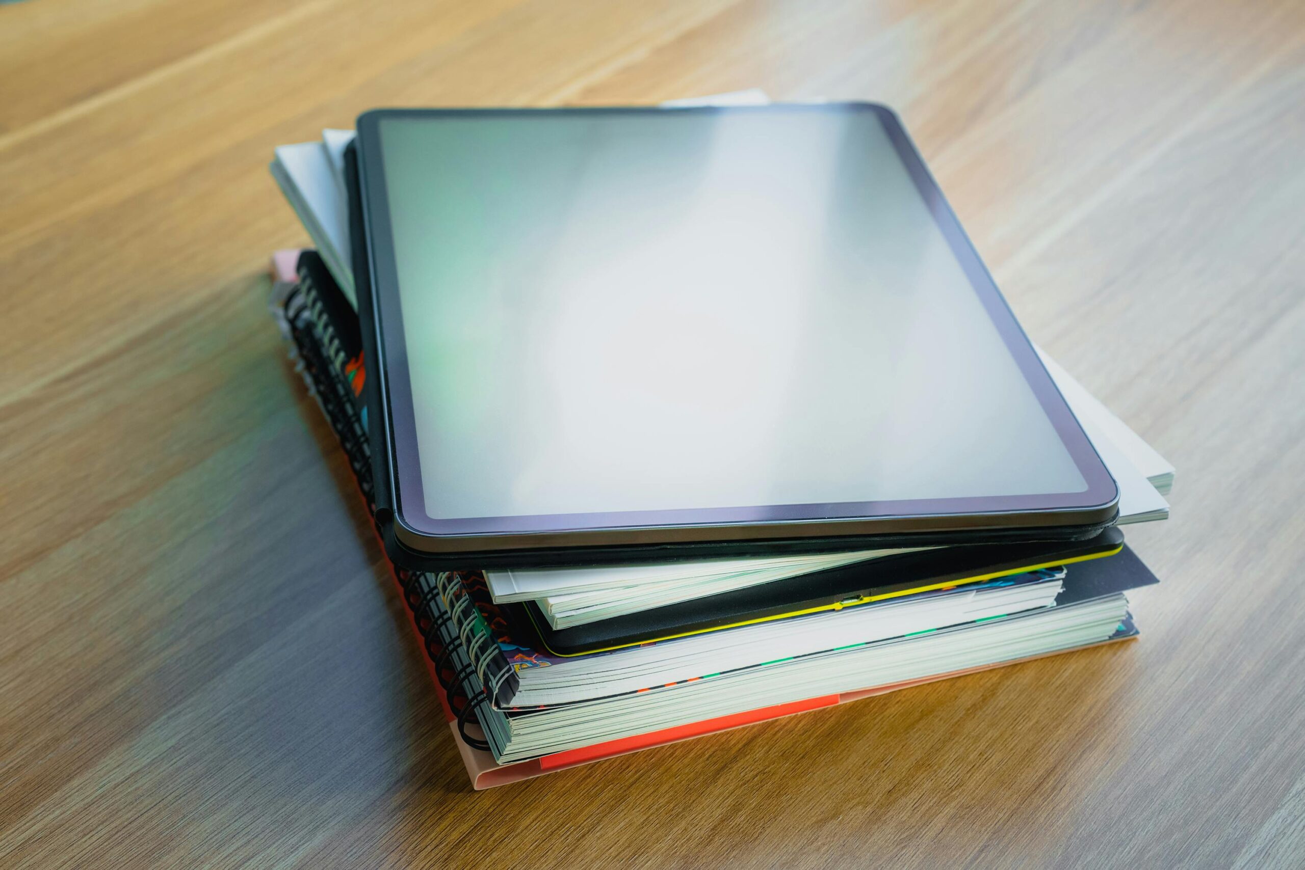 Stack of cybersecurity books with a shield and padlock icon, symbolizing protection. Titles focus on cybersecurity strategies, risk management, and data protection for businesses